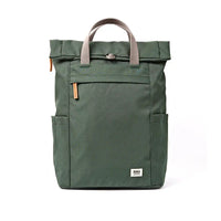 An dark green roll-top backpack with grey handles and small orange-brown leather accents, shown against a plain white background.