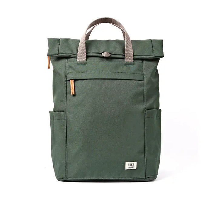 An dark green roll-top backpack with grey handles and small orange-brown leather accents, shown against a plain white background.
