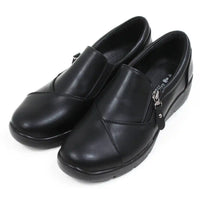 Black low heeled shoes with side short zips. Angled view.