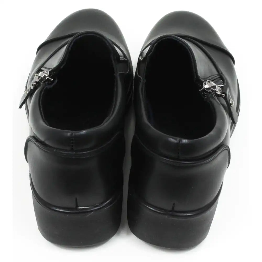 Black low heeled shoes with side short zips. Back view.