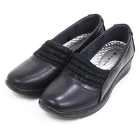 Shoe Tree Irene navy leather look shoes. Slip on with silver insoles. Low heels. Angled view.