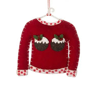 Christmas decoration of a red sweater with Christmas pudding design on a white background