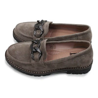 Pair of brown loafers with braided detail on a white background