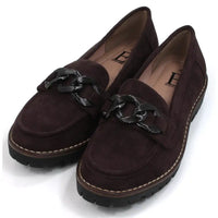 Pair of brown loafers with black decorative accents on a white background. Angled view.