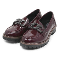 A pair of glossy burgundy patent leather penny loafers with chunky black chain strap details and black lug soles, shown on a white background.