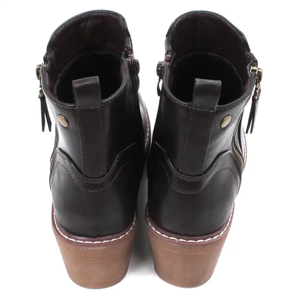 Dark brown Chelsea style ankle boots with light brown wedge soles and heels.