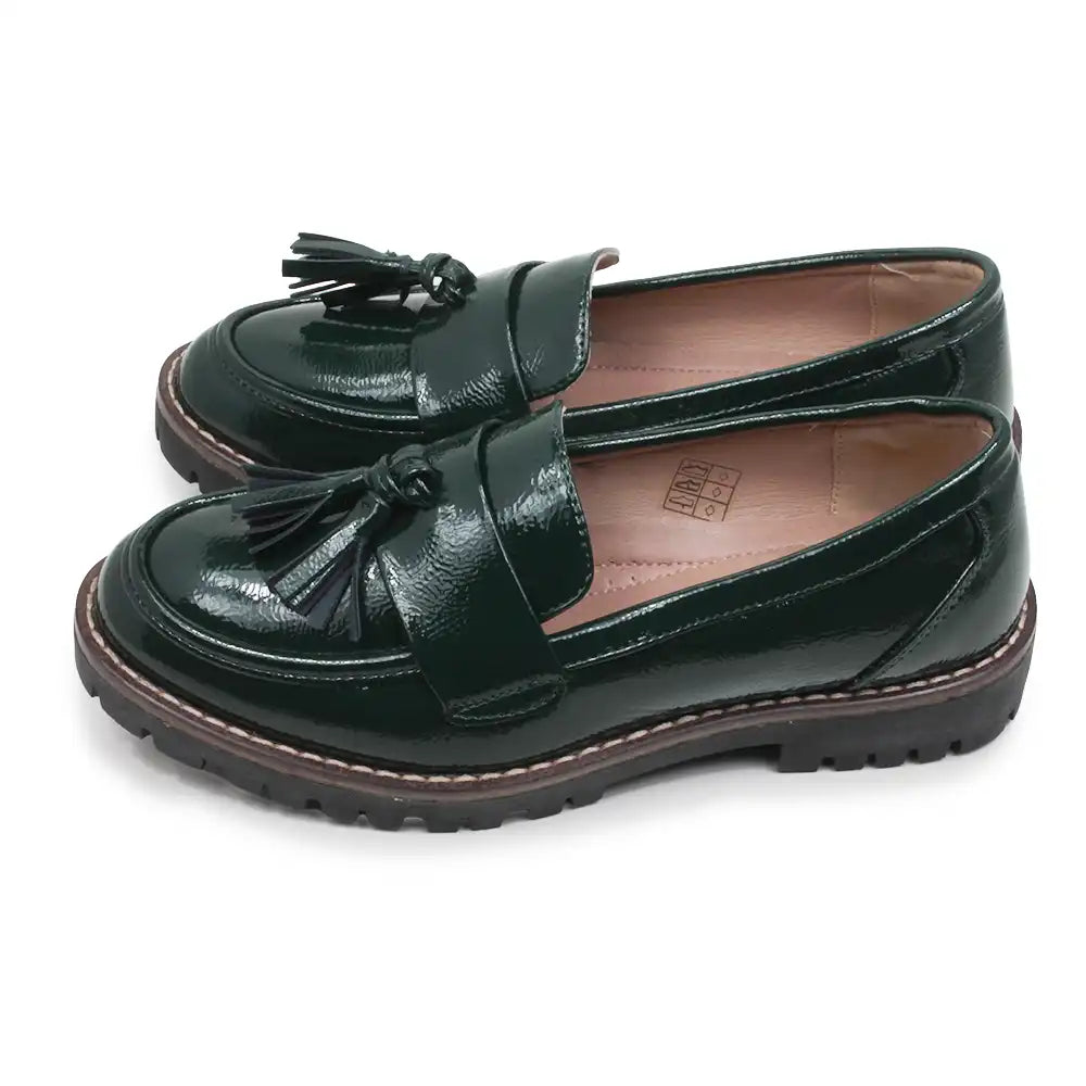 A pair of dark forest green patent leather loafers with tassel details, shown on a clean white background.