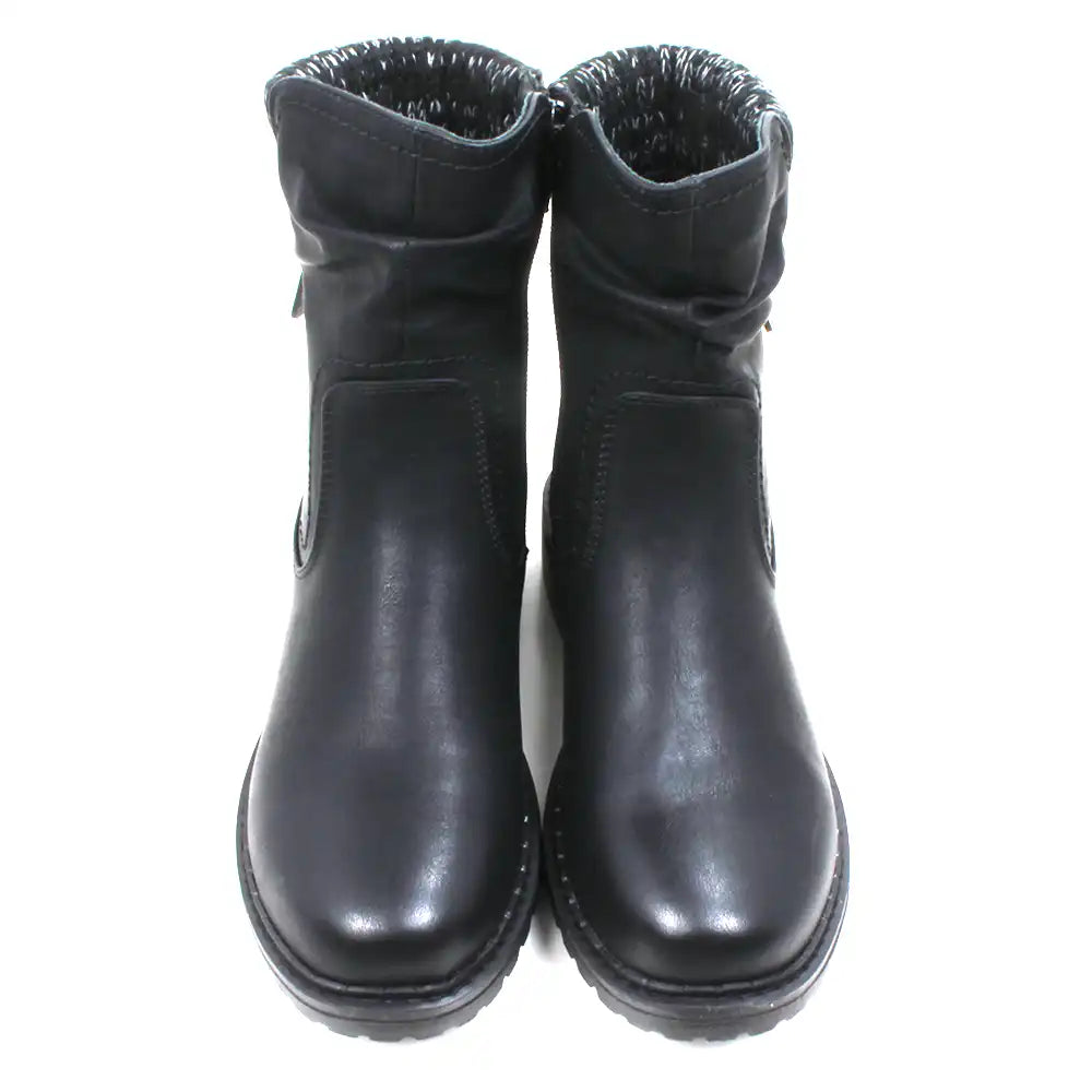 Black leather look ankle boots with grey and white knitted ankle cuffs. Low heels. Front view.