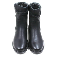 Black leather look ankle boots with grey and white knitted ankle cuffs. Low heels. Front view.