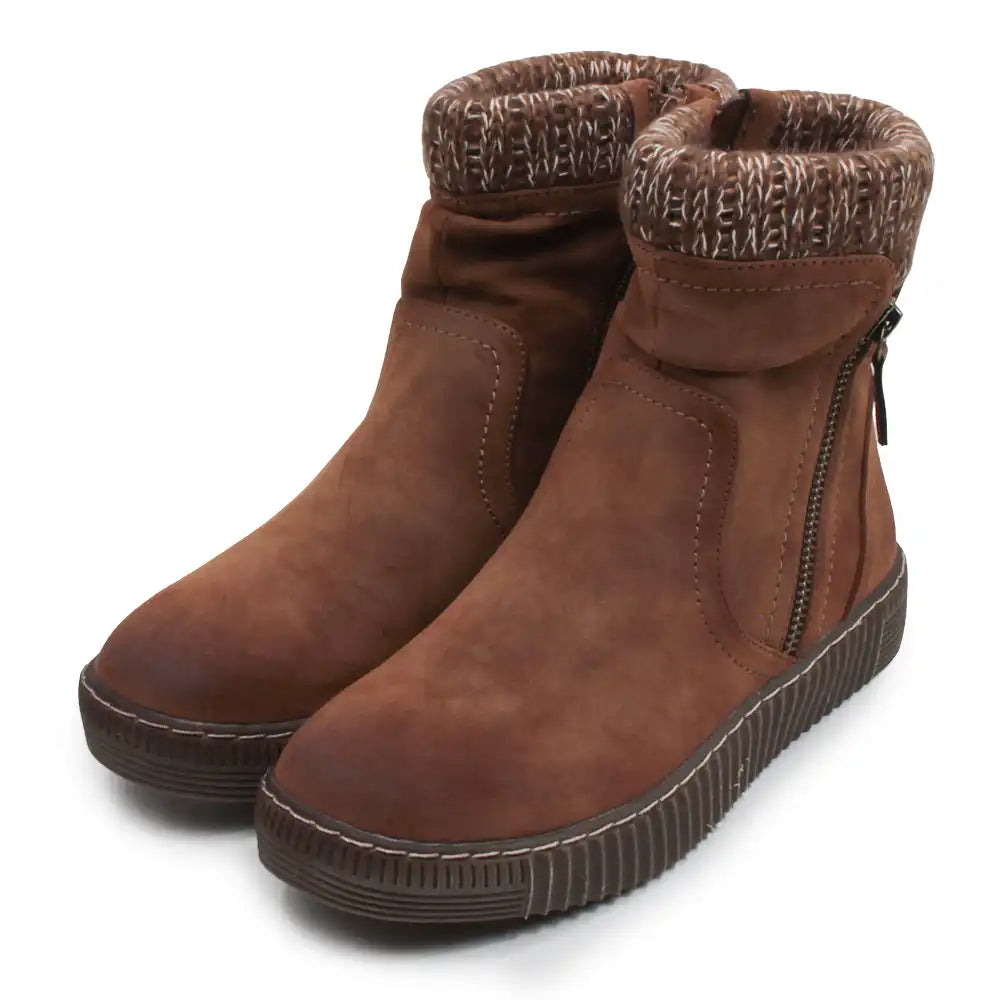 A pair of brown suede ankle boots with a ribbed sole, side zipper, and a patterned knit cuff, shown on a white background.