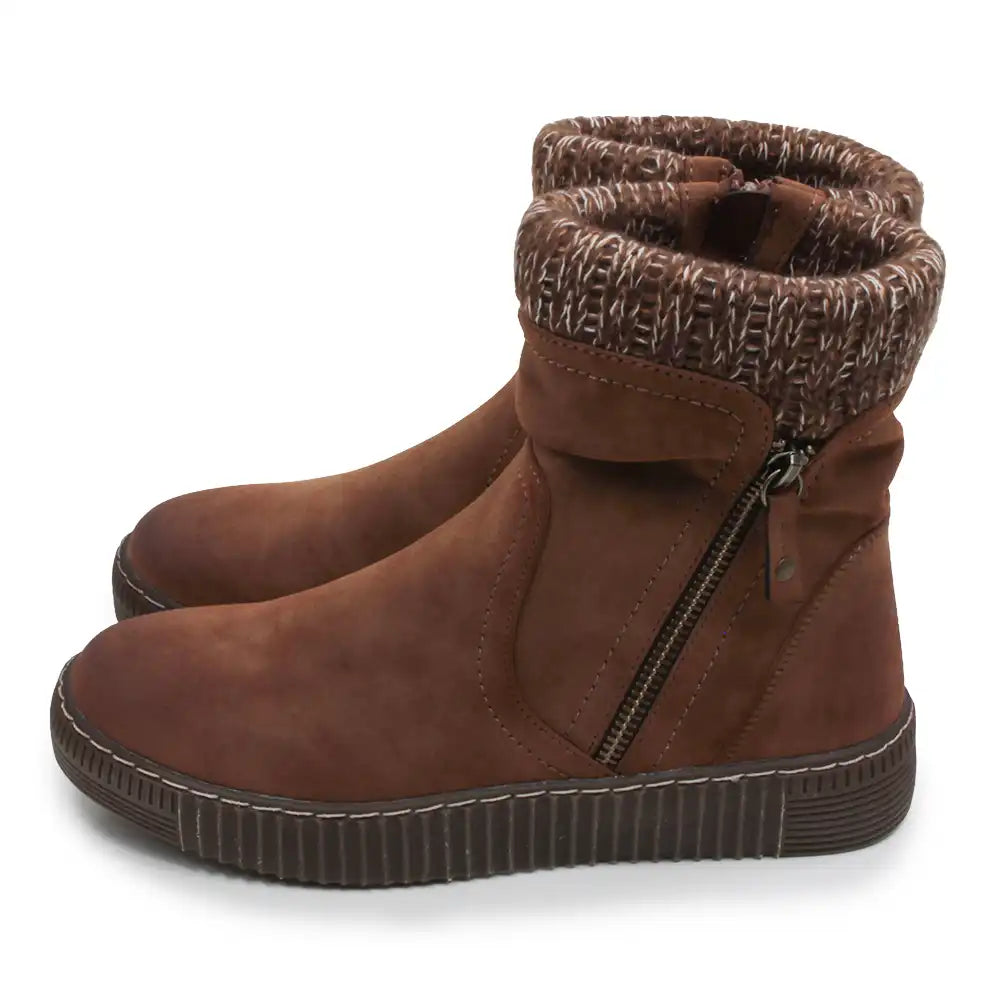 A pair of brown suede ankle boots with a knit patterned cuff, side zippers, and ribbed soles, shown against a plain white background.