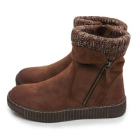 A pair of brown suede ankle boots with a knit patterned cuff, side zippers, and ribbed soles, shown against a plain white background.