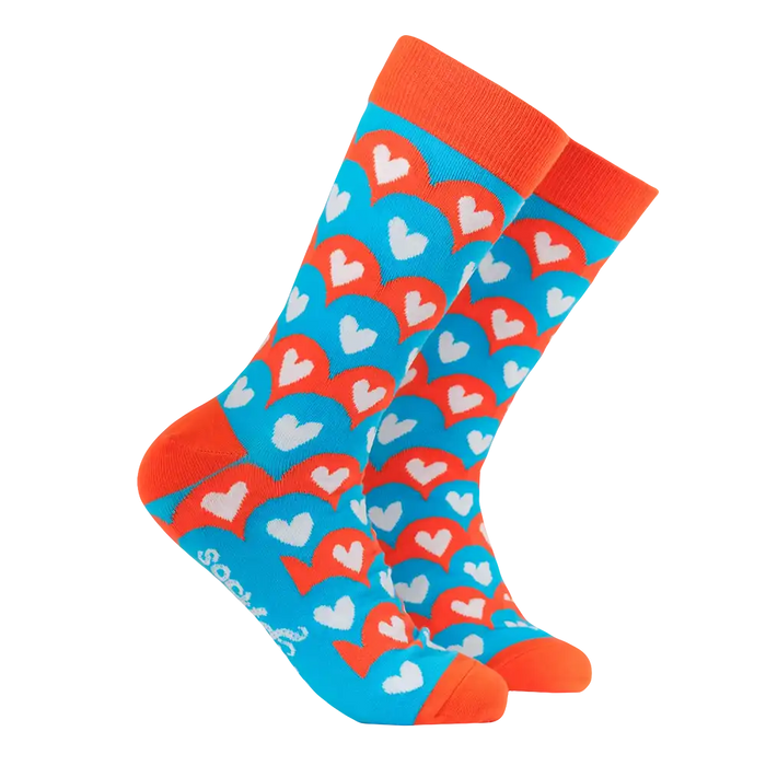 Colourful heart-patterned sock with orange accents on a white background