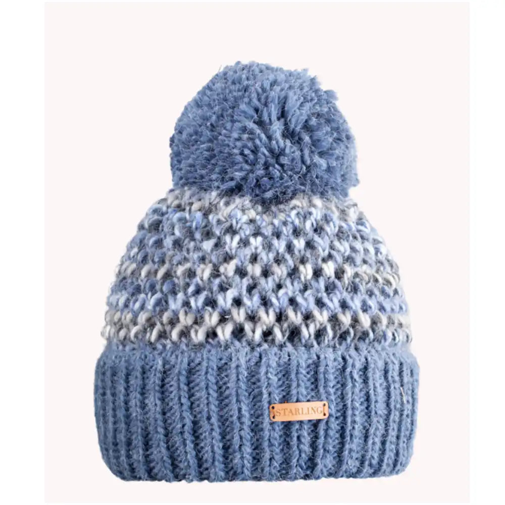 Blue knitted beanie with pom-pom on a white background