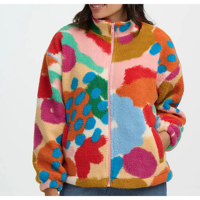 Colorful patterned jacket worn by a person on a white background