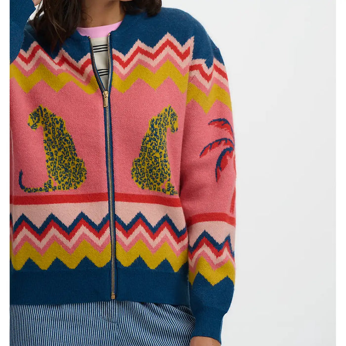 Colorful sweater with animal design on a plain background