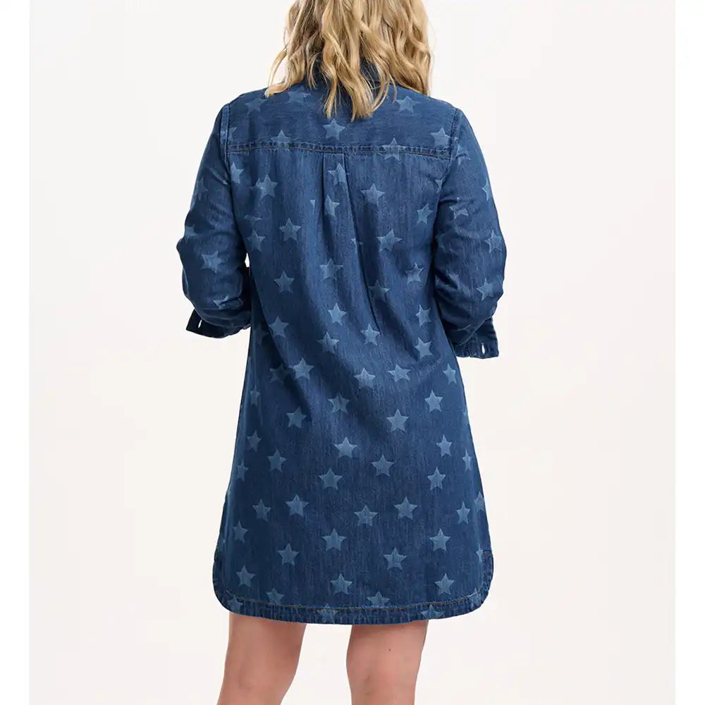 Blue denim dress with star pattern worn by a person on a white background