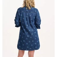 Blue denim dress with star pattern worn by a person on a white background