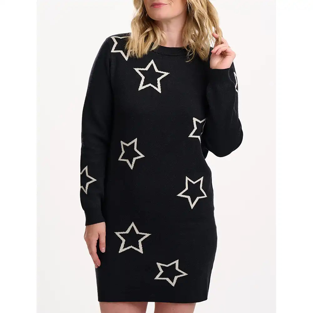 Black dress with white star patterns worn by a person on a white background