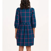 Back view of a person wearing a blue and pink plaid dress on a white background