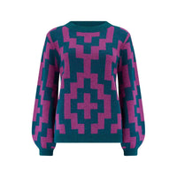 Teal and pink geometric patterned sweater on a white background