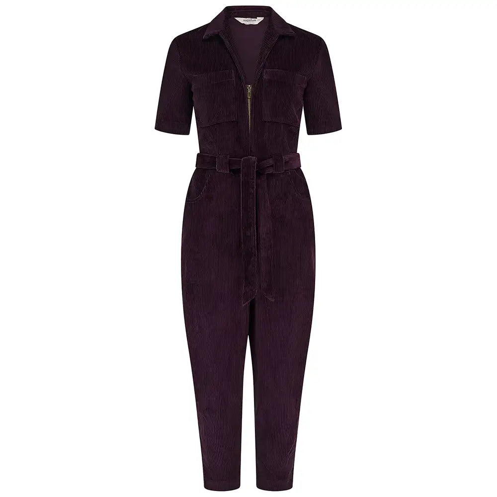 Short sleeved, cropped leg dark plum coloured, zip-up  boilersuit in a white studio environment.