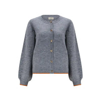 Grey cardigan with gold heart shaped buttons in a white studio environment.