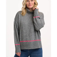 Woman wearing a gray sweater with pink accents on a white background