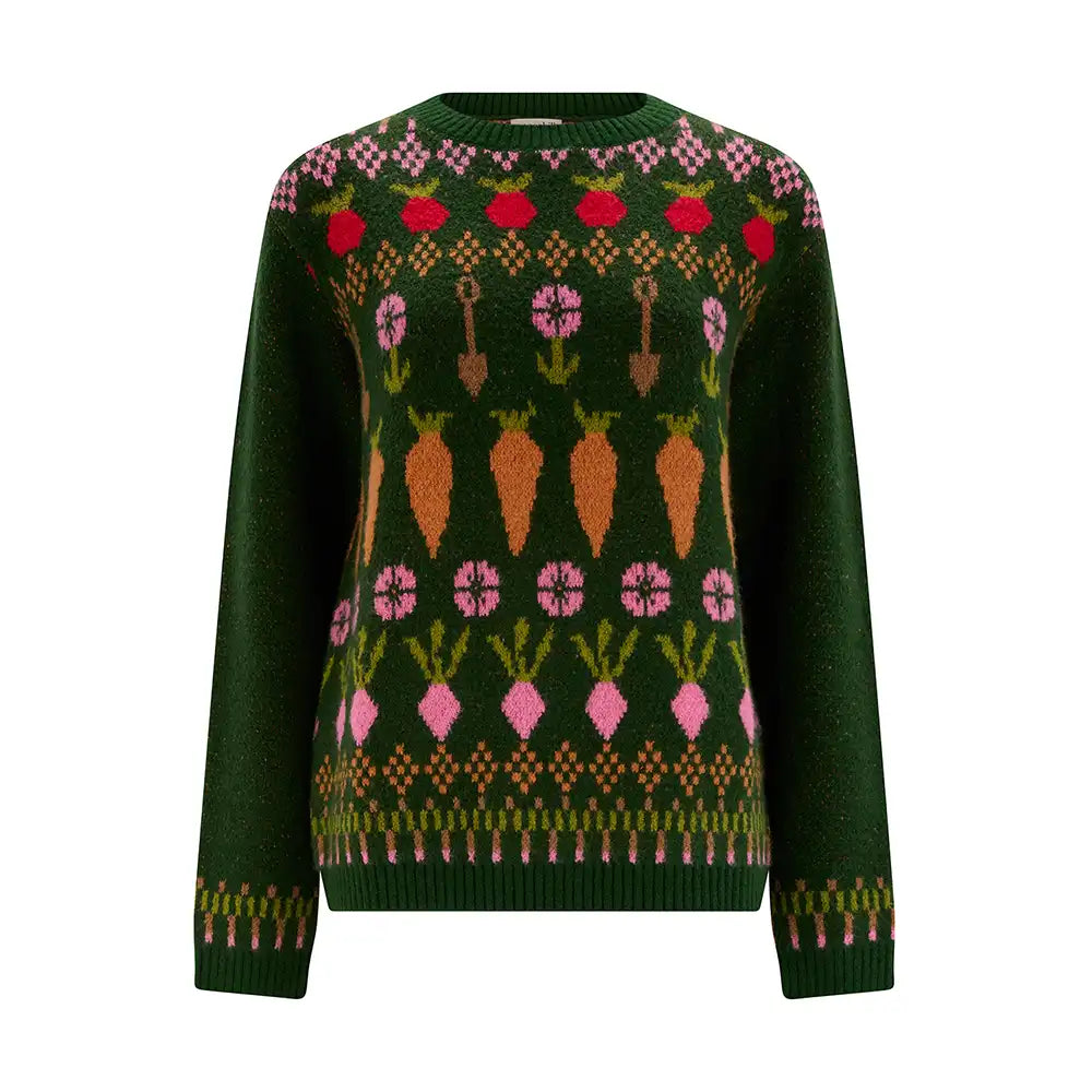 A dark green knit sweater featuring a colorful winter vegetable pattern with carrots, radishes, and flowers across the chest and shoulders, set against a plain white background.