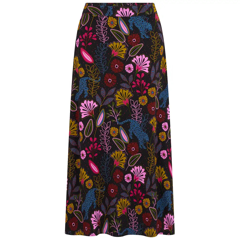 A high-waisted, A-line midi skirt featuring a vibrant, multicolored botanical and bird pattern on a black background, shown flat against a solid white backdrop.