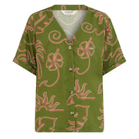 Green shirt with red floral pattern on a white background