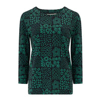 Green patterned dress on a white background