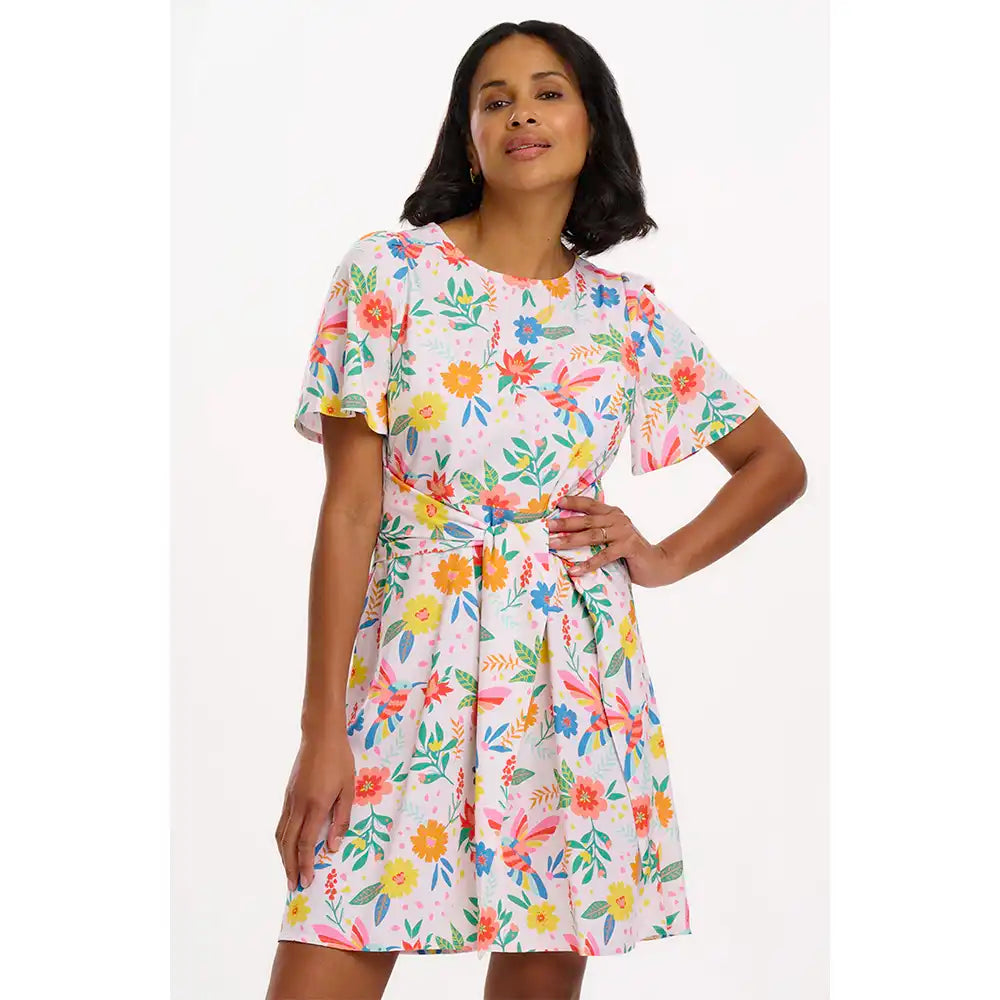 Woman wearing a floral dress on a white background