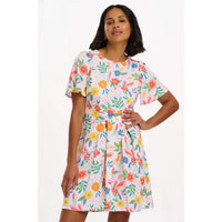 Woman wearing a floral dress on a white background