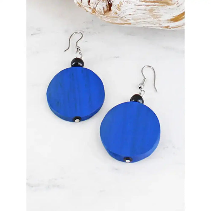 Blue round earrings with black beads on a white background