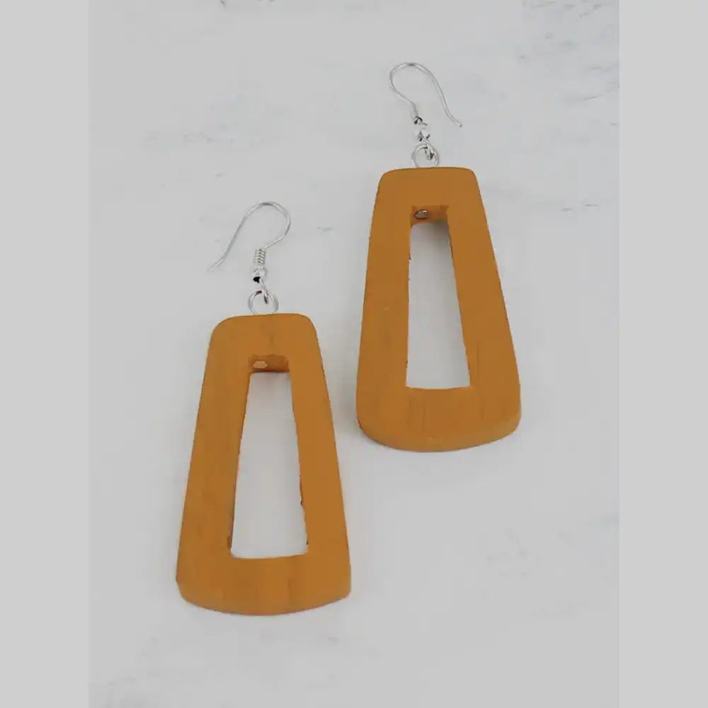 Orange earrings with silver hooks on a light gray background