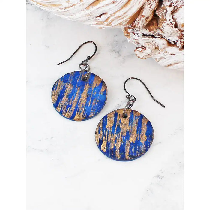 Round earrings on silver hooks in blue and gold colour.