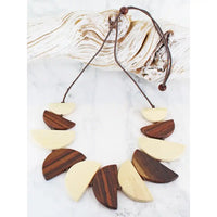 Necklace with wooden beads on a white background