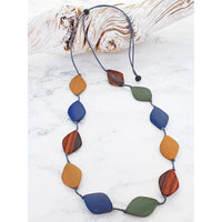 Necklace with colorful beads on a white surface