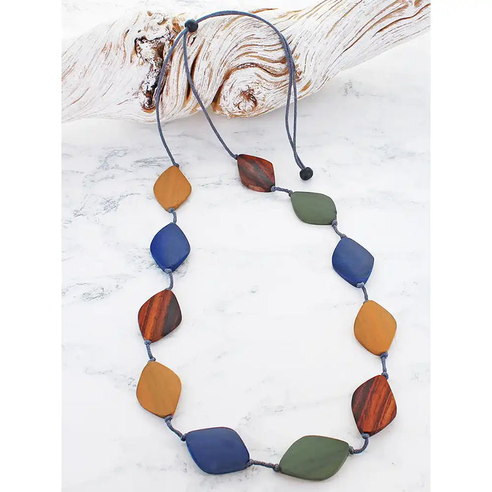 Necklace with colorful beads on a white surface