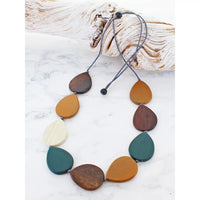 Necklace with multicolored teardrop-shaped pendants on a white background