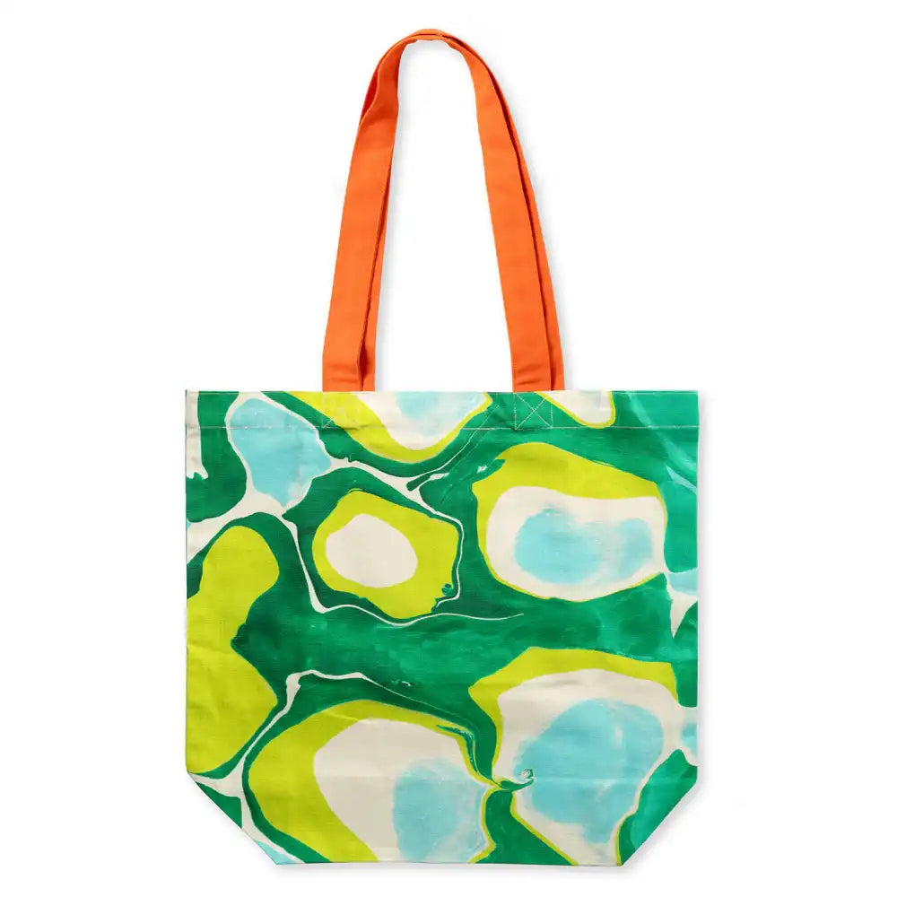 Cotton shopping tote bag with bold greens pattern and an orange handle.