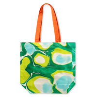 Cotton shopping tote bag with bold greens pattern and an orange handle.