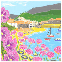 Greetings card with modern stylized picture of flowers in the foreground against a scene of a village by a beach around a bay with boats.