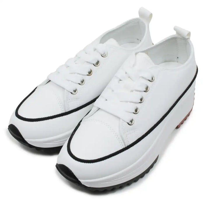 White sneakers with black accents on a white background