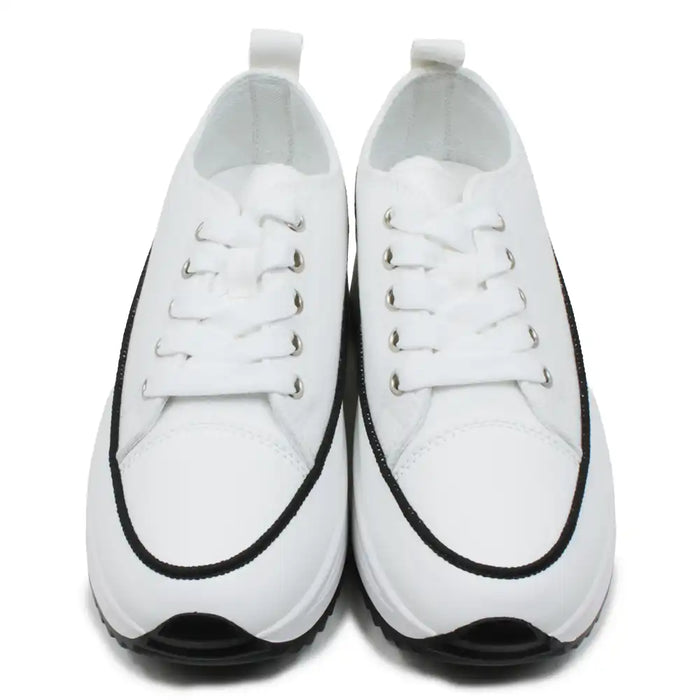 Pair of white sneakers with black accents on a white background