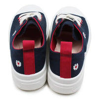 Navy low top sneakers with flower embroidery on white background.