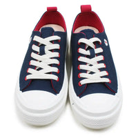 Navy blue sneakers with white laces and red accents on a white background