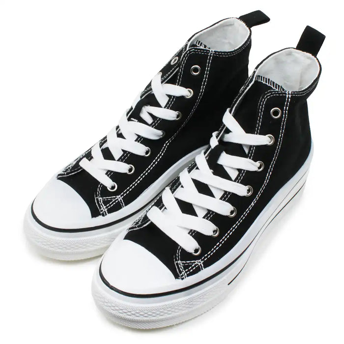 Black high top trainers with white laces.