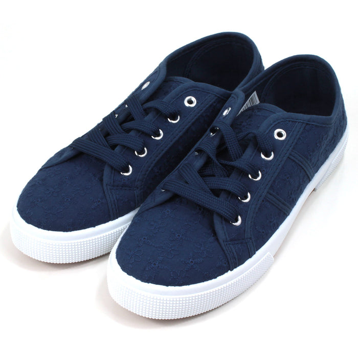 Urban Jacks Navy blue plimsol style shoes with flat navy laces with 5 eyes. White rubber soles extending up the sides. Angled view. 